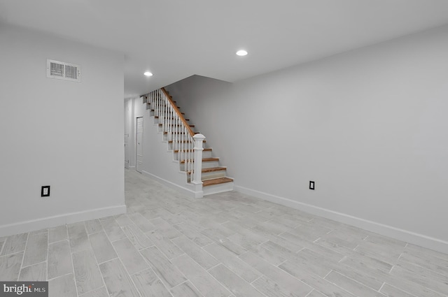 2002 E Lafayette Ave, Baltimore, MD 21213 - below grade area featuring stairs, recessed lighting, and light wood-style flooring