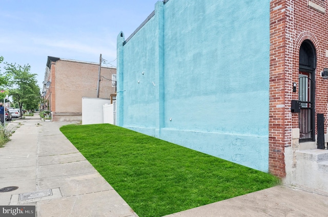 2002 E Lafayette Ave, Baltimore, MD 21213 - view of home's exterior featuring stucco siding