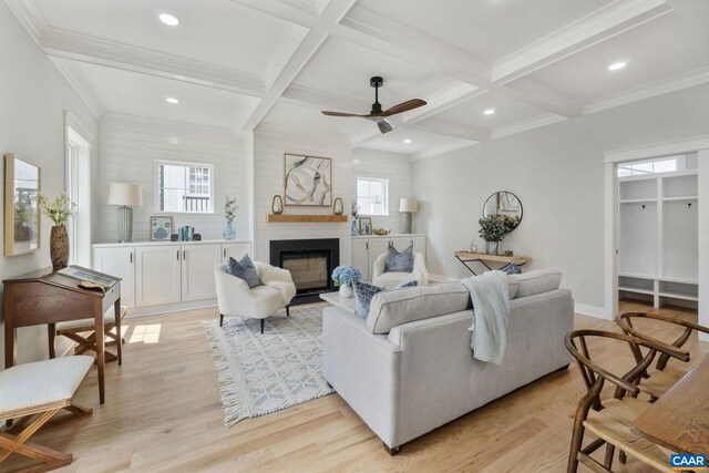 1603 Griffen Grv, Charlottesville, VA 22901 - living room featuring light wood-type flooring, a fireplace, coffered ceiling, beam ceiling, and healthy amount of natural light