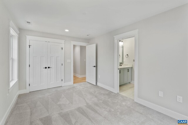 1603 Griffen Grv, Charlottesville, VA 22901 - unfurnished bedroom with light colored carpet, a closet, connected bathroom, and recessed lighting