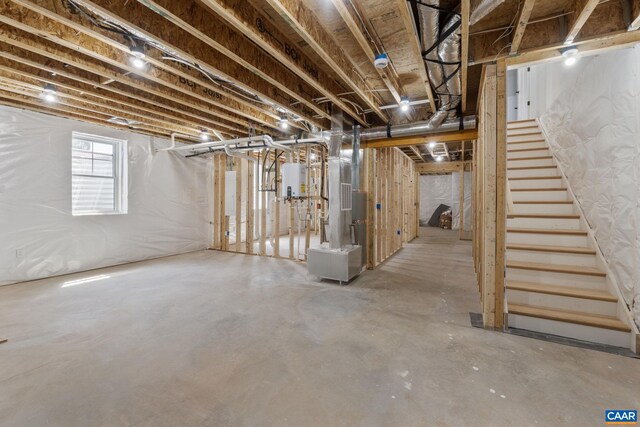 1603 Griffen Grv, Charlottesville, VA 22901 - below grade area featuring stairway, heating unit, and water heater