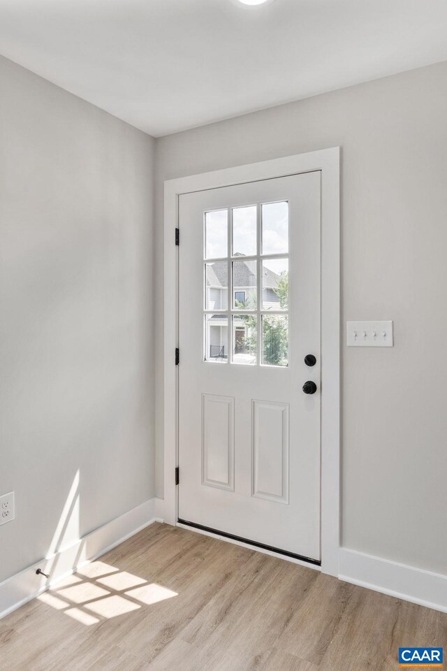 1603 Griffen Grv, Charlottesville, VA 22901 - doorway featuring light wood finished floors and baseboards