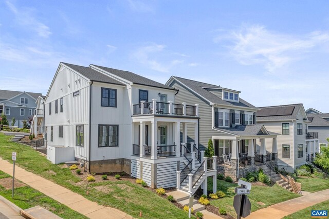 1603 Griffen Grv, Charlottesville, VA 22901 - view of front of house featuring a balcony, covered porch, stairs, and a residential view
