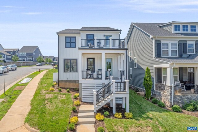 1603 Griffen Grv, Charlottesville, VA 22901 - view of front of property featuring a balcony, a porch, a front yard, board and batten siding, and stairs