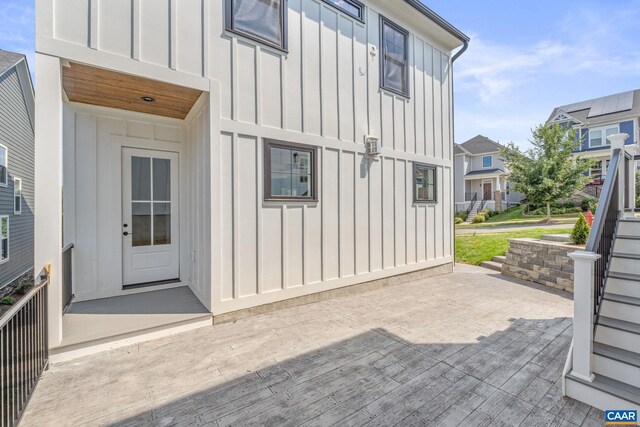 1603 Griffen Grv, Charlottesville, VA 22901 - view of exterior entry featuring board and batten siding and a wooden deck