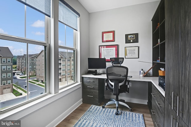 3421 Angelica Way Unit 404, Frederick, MD 21704 - home office featuring dark wood-style flooring and built in study area
