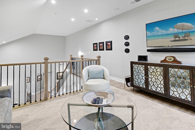 3421 Angelica Way Unit 404, Frederick, MD 21704 - sitting room with wood finished floors, recessed lighting, vaulted ceiling, and an upstairs landing