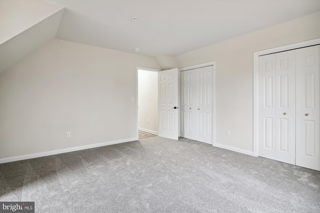 104 Clark Ct, Millington, MD 21651 - unfurnished bedroom with two closets, carpet floors, and vaulted ceiling
