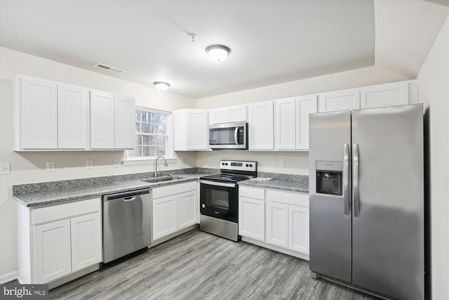 104 Clark Ct, Millington, MD 21651 - kitchen featuring appliances with stainless steel finishes, white cabinetry, and light wood finished floors