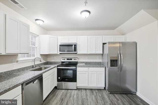 104 Clark Ct, Millington, MD 21651 - kitchen featuring stainless steel appliances, wood finished floors, light stone countertops, and white cabinets