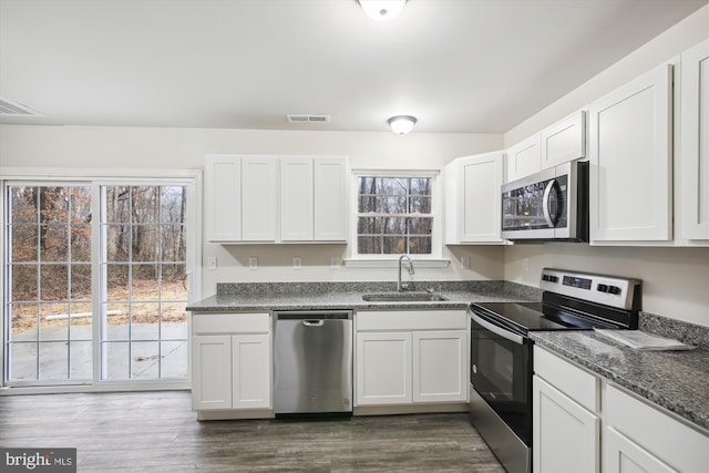 104 Clark Ct, Millington, MD 21651 - kitchen featuring stainless steel appliances, white cabinetry, plenty of natural light, and dark wood-style flooring