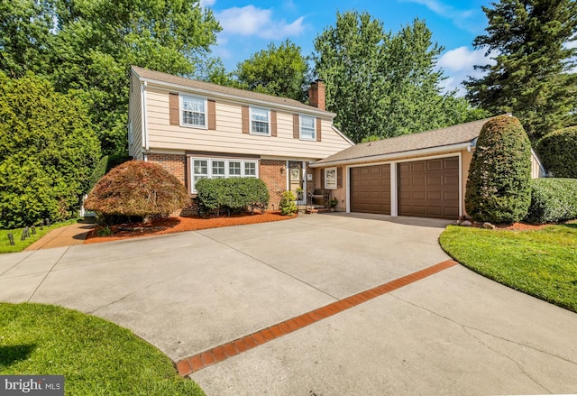124 Connecticut Ave, Cherry Hill, NJ 08002 - colonial house featuring concrete driveway, a chimney, an attached garage, and brick siding