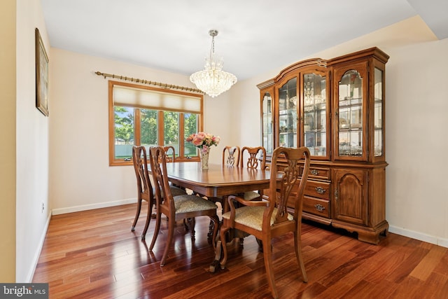 4 Monterey Ln, Manalapan, NJ 07726 - dining area featuring wood finished floors and a chandelier