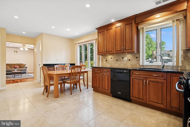 4 Monterey Ln, Manalapan, NJ 07726 - kitchen featuring black appliances, tasteful backsplash, brown cabinetry, recessed lighting, and light tile patterned floors