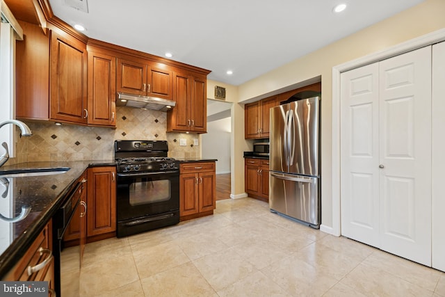 4 Monterey Ln, Manalapan, NJ 07726 - kitchen featuring stainless steel appliances, under cabinet range hood, tasteful backsplash, dark stone countertops, and brown cabinetry