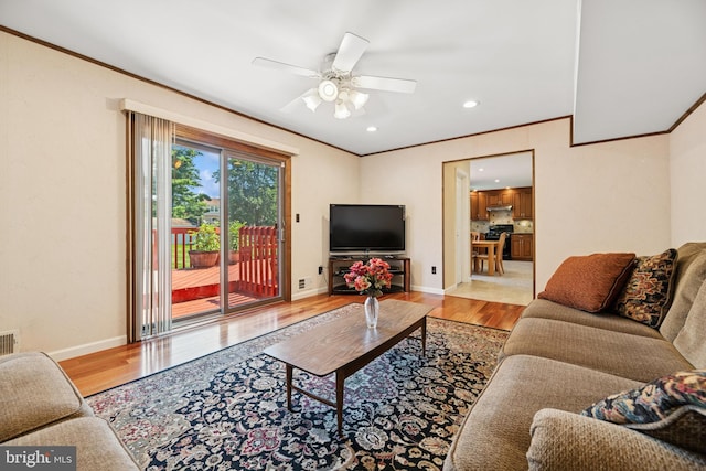 4 Monterey Ln, Manalapan, NJ 07726 - living room with wood finished floors, ceiling fan, crown molding, and recessed lighting