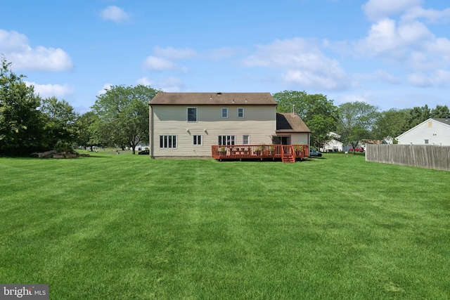 4 Monterey Ln, Manalapan, NJ 07726 - back of property featuring a wooden deck