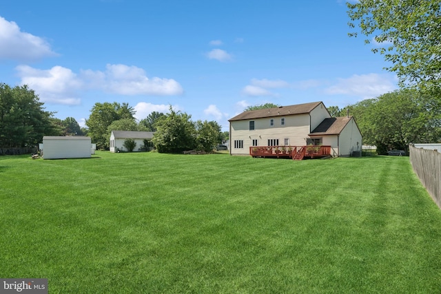 4 Monterey Ln, Manalapan, NJ 07726 - view of yard featuring a wooden deck and a shed