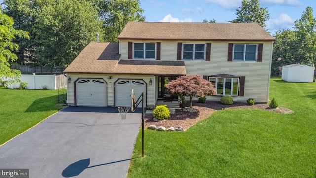 4 Monterey Ln, Manalapan, NJ 07726 - view of front of property featuring asphalt driveway, an attached garage, and roof with shingles