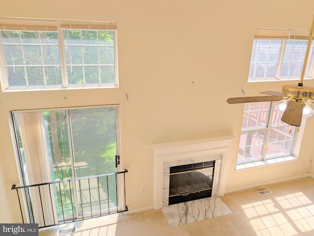 7805 Chartwell Pl, Greenbelt, MD 20770 - unfurnished living room featuring a ceiling fan and a premium fireplace