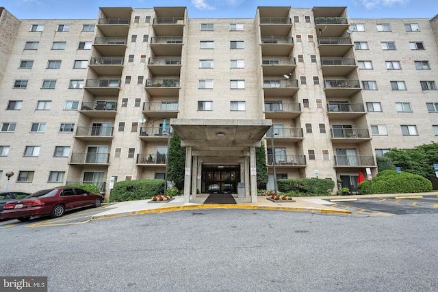 12001 Old Columbia Pike Unit 305, Silver Spring, MD 20904 - view of apartment building / complex featuring uncovered parking