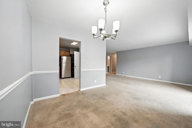 12001 Old Columbia Pike Unit 305, Silver Spring, MD 20904 - spare room featuring a chandelier and light carpet