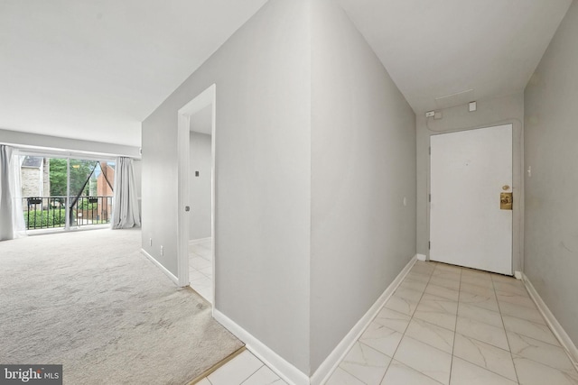 12001 Old Columbia Pike Unit 305, Silver Spring, MD 20904 - hallway featuring light marble finish floors and baseboards