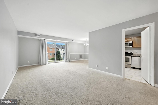 12001 Old Columbia Pike Unit 305, Silver Spring, MD 20904 - spare room with light carpet and a chandelier