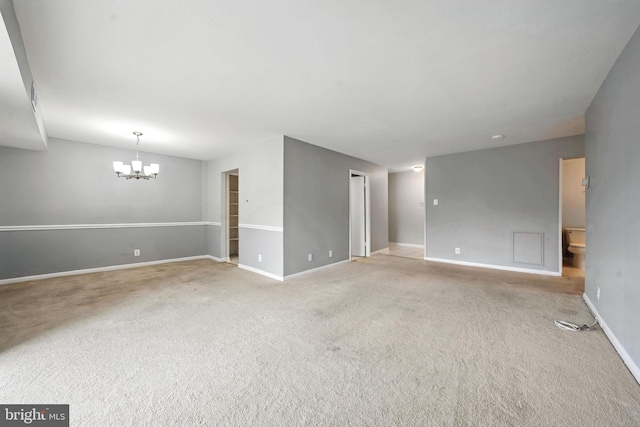 12001 Old Columbia Pike Unit 305, Silver Spring, MD 20904 - spare room with a chandelier and carpet floors