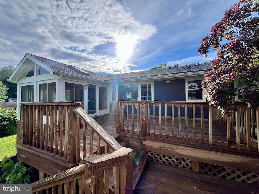 1509 Seminole Ln, Finksburg, MD 21048 - back of property with a sunroom, roof with shingles, and a deck
