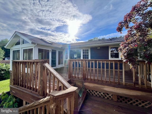 1509 Seminole Ln, Finksburg, MD 21048 - back of property with a sunroom, roof with shingles, and a deck
