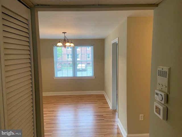 1601 Belle View Blvd Unit A1, Alexandria, VA 22307 - unfurnished dining area with light wood-type flooring and a chandelier