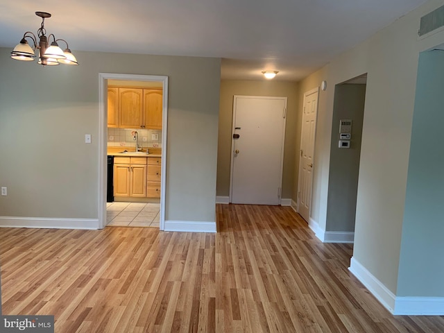 1601 Belle View Blvd Unit A1, Alexandria, VA 22307 - foyer entrance featuring light wood finished floors and a chandelier