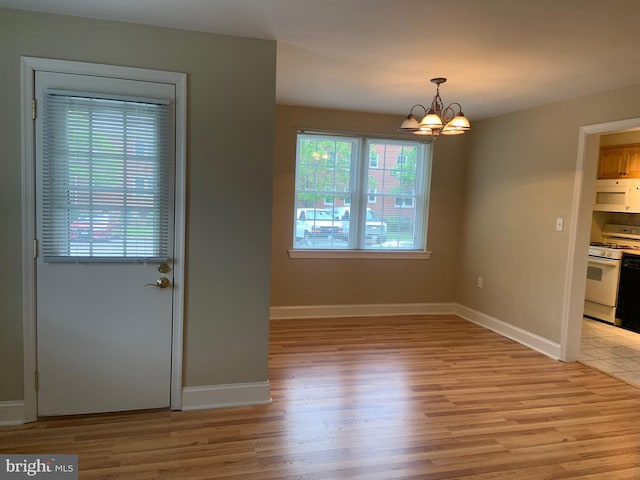 1601 Belle View Blvd Unit A1, Alexandria, VA 22307 - unfurnished dining area with light wood-style floors and a chandelier