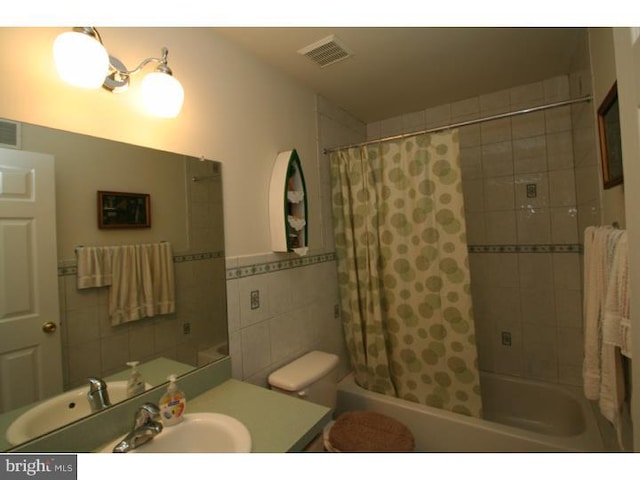 5 Vaccaro Rd, Lawrenceville, NJ 08648 - full bathroom with tile walls, vanity, and shower / bath combo with shower curtain
