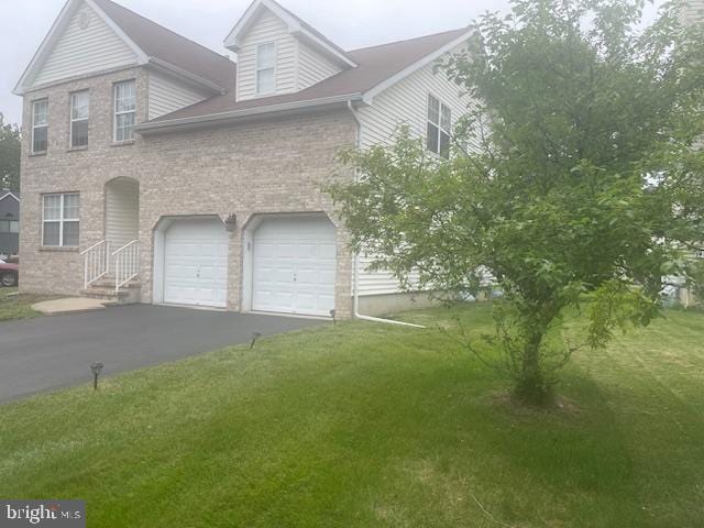 5 Vaccaro Rd, Lawrenceville, NJ 08648 - view of front facade with a garage, a front yard, asphalt driveway, and brick siding