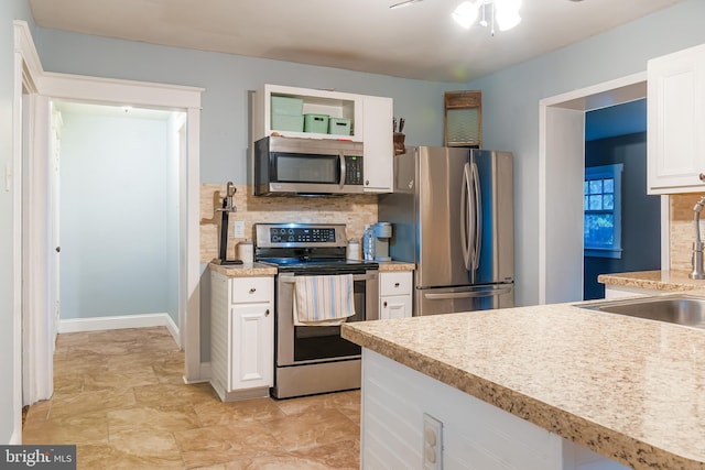 850 N Reading Ave, Boyertown, PA 19512 - kitchen featuring appliances with stainless steel finishes, tasteful backsplash, white cabinets, and light countertops
