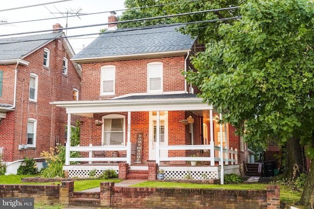 850 N Reading Ave, Boyertown, PA 19512 - view of front of house featuring a porch, brick siding, a shingled roof, and a chimney