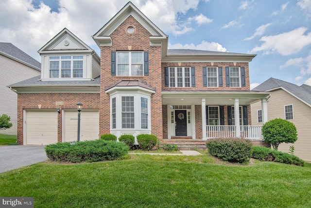 13319 Moonlight Trail Dr, Silver Spring, MD 20906 - view of front of property with brick siding, a front lawn, asphalt driveway, a porch, and a garage