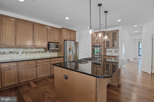 13319 Moonlight Trail Dr, Silver Spring, MD 20906 - kitchen featuring stainless steel appliances, a center island, recessed lighting, tasteful backsplash, and glass insert cabinets