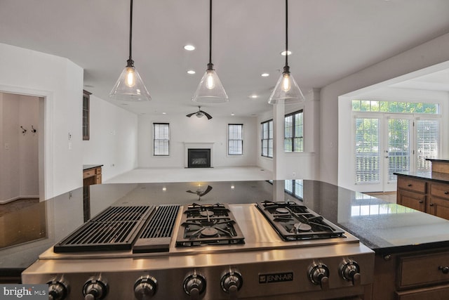 13319 Moonlight Trail Dr, Silver Spring, MD 20906 - kitchen featuring recessed lighting, open floor plan, a fireplace, stainless steel gas stovetop, and dark stone counters