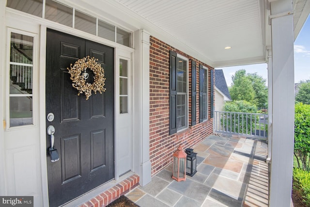 13319 Moonlight Trail Dr, Silver Spring, MD 20906 - view of exterior entry with a porch and brick siding