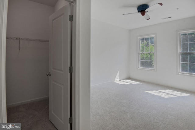 13319 Moonlight Trail Dr, Silver Spring, MD 20906 - unfurnished bedroom with carpet, a spacious closet, a closet, and ceiling fan