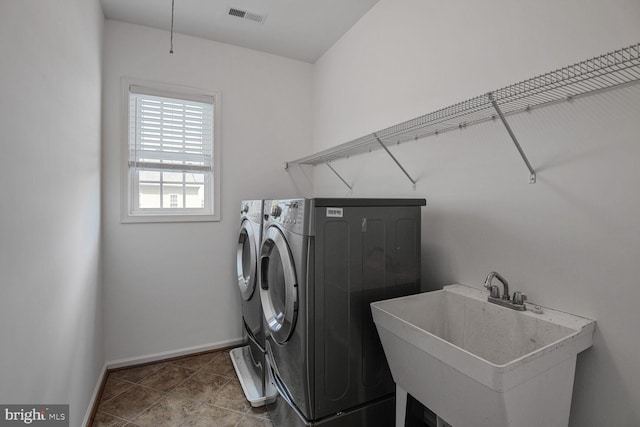 13319 Moonlight Trail Dr, Silver Spring, MD 20906 - laundry area with washing machine and dryer and tile patterned flooring
