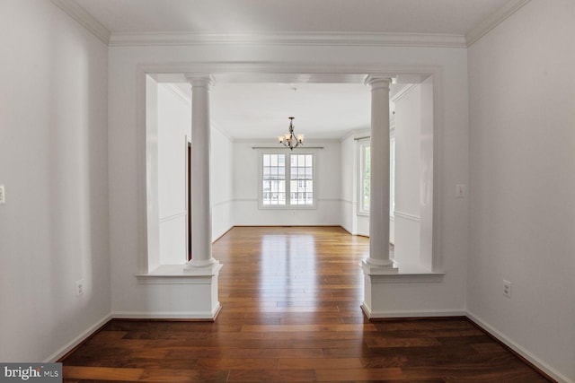 13319 Moonlight Trail Dr, Silver Spring, MD 20906 - spare room featuring a chandelier, wood finished floors, ornamental molding, and decorative columns