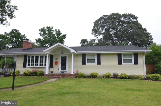 514 Red Oak Dr, Severna Park, MD 21146 - ranch-style home with a chimney, a front lawn, and a carport