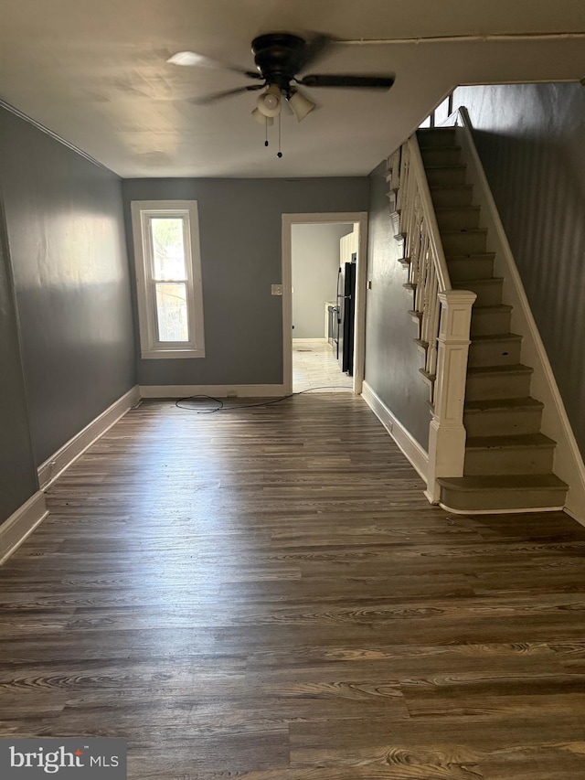 1631 Cotton St, Reading, PA 19606 - spare room featuring a ceiling fan, stairway, and dark wood-style floors