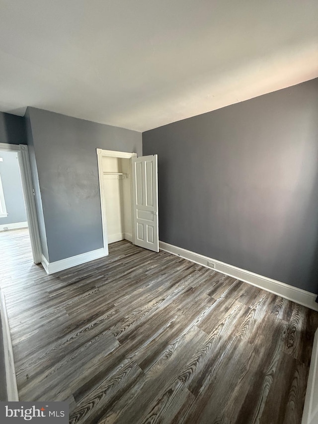 1631 Cotton St, Reading, PA 19606 - unfurnished bedroom with dark wood-style flooring and a closet