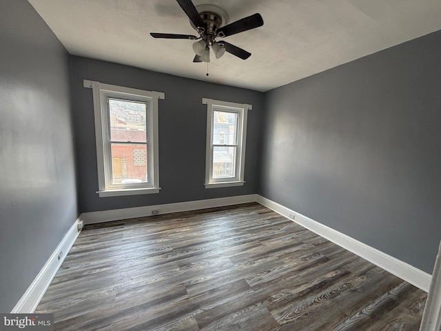 1631 Cotton St, Reading, PA 19606 - empty room with ceiling fan and dark wood-style flooring