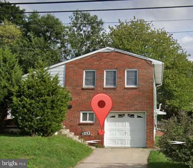 7218 Irving Ave, Pennsauken, NJ 08109 - view of front of property featuring brick siding, a garage, and concrete driveway